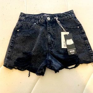 Black distressed denim shorts.
